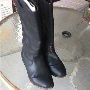 Tall flat black boots